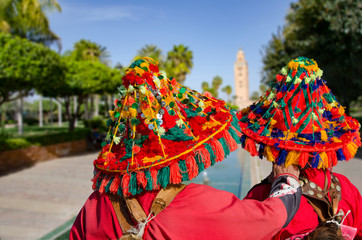 Colorful people in front of the Koutoubia mosque in Marrakesh, Morocco