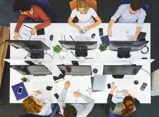 Poster - Diverse young team working at coworking place, top view