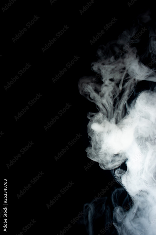 louds of vape fog on black background. At right side thick smoke rising  up. Vape culture and no smoking movement. Stock Photo | Adobe Stock