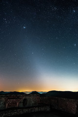 Wall Mural - The Zodiacal Light photographed from the Lindelbrunn ruin in the palatinate forest near Vorderweidenthal in Germany.
