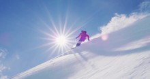 Skier Doing Amazing Powder Turns In Slow Motion Backlit, Epic Backcountry Ski Adventure Holiday