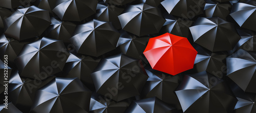 Cuadros en Lienzo Unique red umbrella among many dark ones