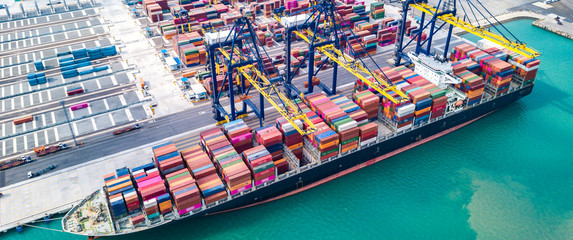 Wall Mural - Cargo ship, loading and unloading goods at the deep sea port