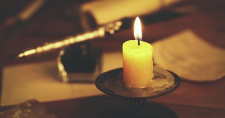 Wall Mural - retro feather pen and vintage items on table in candlelight