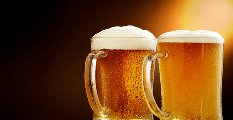 Cold beer and brown background with shadow 