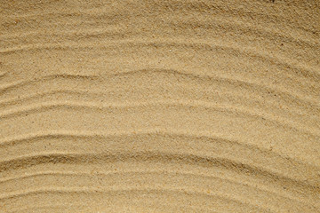 Wall Mural - closeup of sand pattern of a beach in the summer