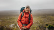 © Jacob Lund - Female hiker standing on a hill
