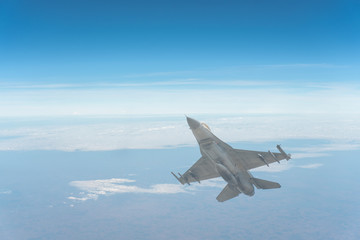 Wall Mural - The F-16 aircraft flew through the atmosphere