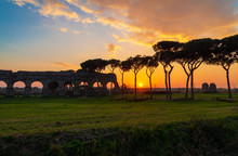 Rome (Italy) - The Parco Degli Acquedotti At Sunset, An Archeological Public Park In Rome, Part Of The Appian Way Regional Park, With Monumental Ruins Of Roman Aqueducts.