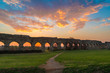 Rome (Italy) - The Parco degli Acquedotti at sunset, an archeological public park in Rome, part of the Appian Way Regional Park, with monumental ruins of roman aqueducts.