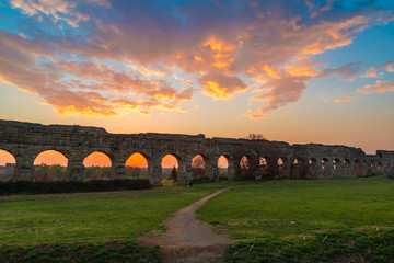 Rome (Italy) - The Parco degli Acquedotti at sunset, an archeological public park in Rome, part of the Appian Way Regional Park, with monumental ruins of roman aqueducts.