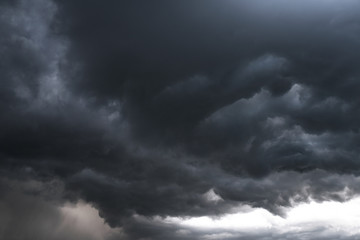Wall Mural - Scary epic sky with menacing clouds. Hurricane wind with a thunderstorm. Stock background, photo