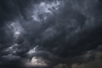 Wall Mural - Scary epic sky with menacing clouds. Hurricane wind with a thunderstorm. Stock background, photo