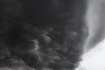 Wall Mural - Scary epic sky with menacing clouds. Hurricane wind with a thunderstorm. Stock background, photo