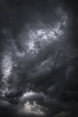 Wall Mural - Scary epic sky with menacing clouds. Hurricane wind with a thunderstorm. Stock background, photo