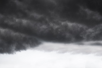 Wall Mural - Scary epic sky with menacing clouds. Hurricane wind with a thunderstorm. Stock background, photo