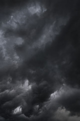 Wall Mural - Scary epic sky with menacing clouds. Hurricane wind with a thunderstorm. Stock background, photo