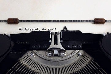 Fototapete - Old retro vintage black typewriter with close-up typing text No Internet, No email as heading on aged paper, blackout concept