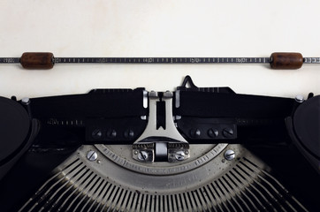 Fototapete - Old retro vintage black typewriter with close-up and copy space on aged paper