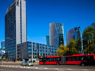 Red bus on Konstitucijos Avenue in Vilnius