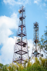 Telecommunications towers with blue sky background