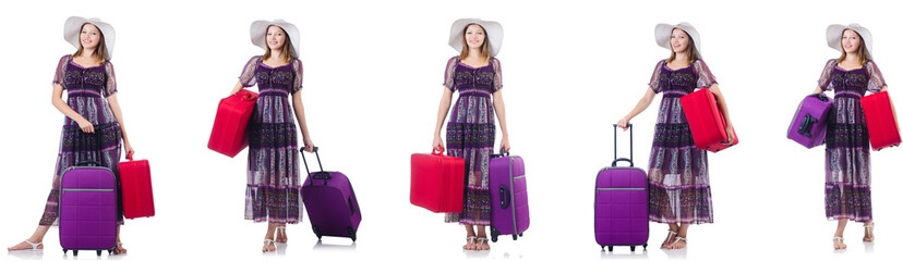 Wall Mural - Young woman with suitcases isolated on white