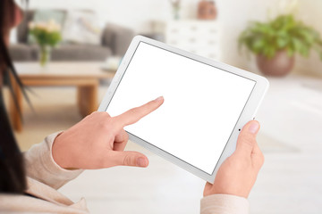 Aufkleber - Woman touch isolated tablet screen. Tehnology mobile concept for app, web site presentation. Mockup. Living room interior in background.