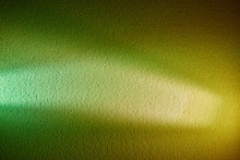 White And Light Green Rays On A Green And Yellow Textured Background