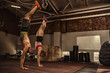 © Zoriana - Athletic young couple doing a handstand at the gym