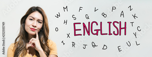 Learning English theme with young woman in a thoughtful fac Fototapet