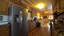 Kitchen Room With Refrigerator In A Log Cabin