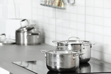 Sticker - Clean pans on stove in kitchen. Space for text