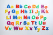 © New Africa - Plastic magnetic letters isolated on white, top view. Alphabetical order