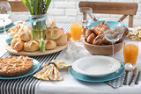 Fototapeta Tulipany - Festive Easter table setting with traditional meal at home