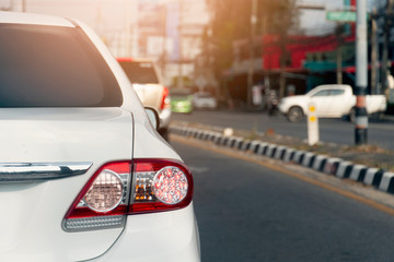 White Car on the road in traffic junction. Open light break.