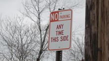 No Parking Any Time This Side Sign In Front Of Telephone Pole