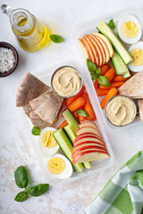 Wall Mural - Healthy and nutricious lunch or snack boxes to go with hummus and pita, eggs and vegetables