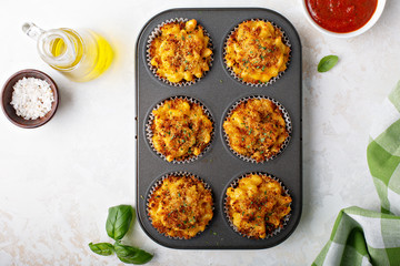 Baked mac and cheese muffins with marinara sauce