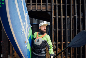 Wall Mural - Man with paddle board