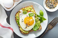 Avocado Toast With Fried Sunny Side Up Egg Overhead View