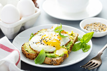 Avocado Toast With Fried Sunny Side Up Egg With Runny Yolk