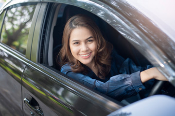 Beautiful woman is driving her car