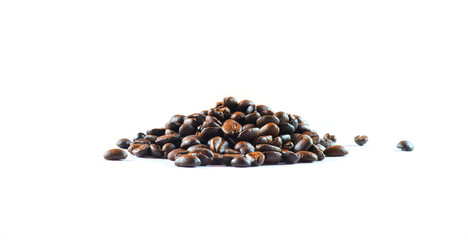 Wall Mural - Roasted coffee beans on white background.