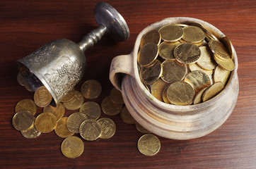 Gold coins in an old clay pot.