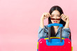 © anon - Traveler tourist woman in summer casual clothes.Asian Smiling woman wearing sun glasses.Passenger traveling abroad to travel on pink background.