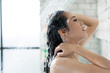 © torwaiphoto - Asian women bathing and she was bathing and washing hair.she is happy