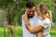 © jiradet_ponari - Man and Woman sweet Lover holding together in public park