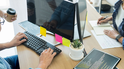 IT office Programmers software development coding technologies On Computer working in a company office