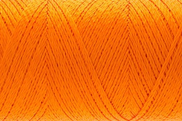 Wall Mural - Macro picture of thread texture orange color background