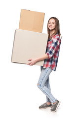 Wall Mural - Smiling young woman holding cardboard boxes in full length